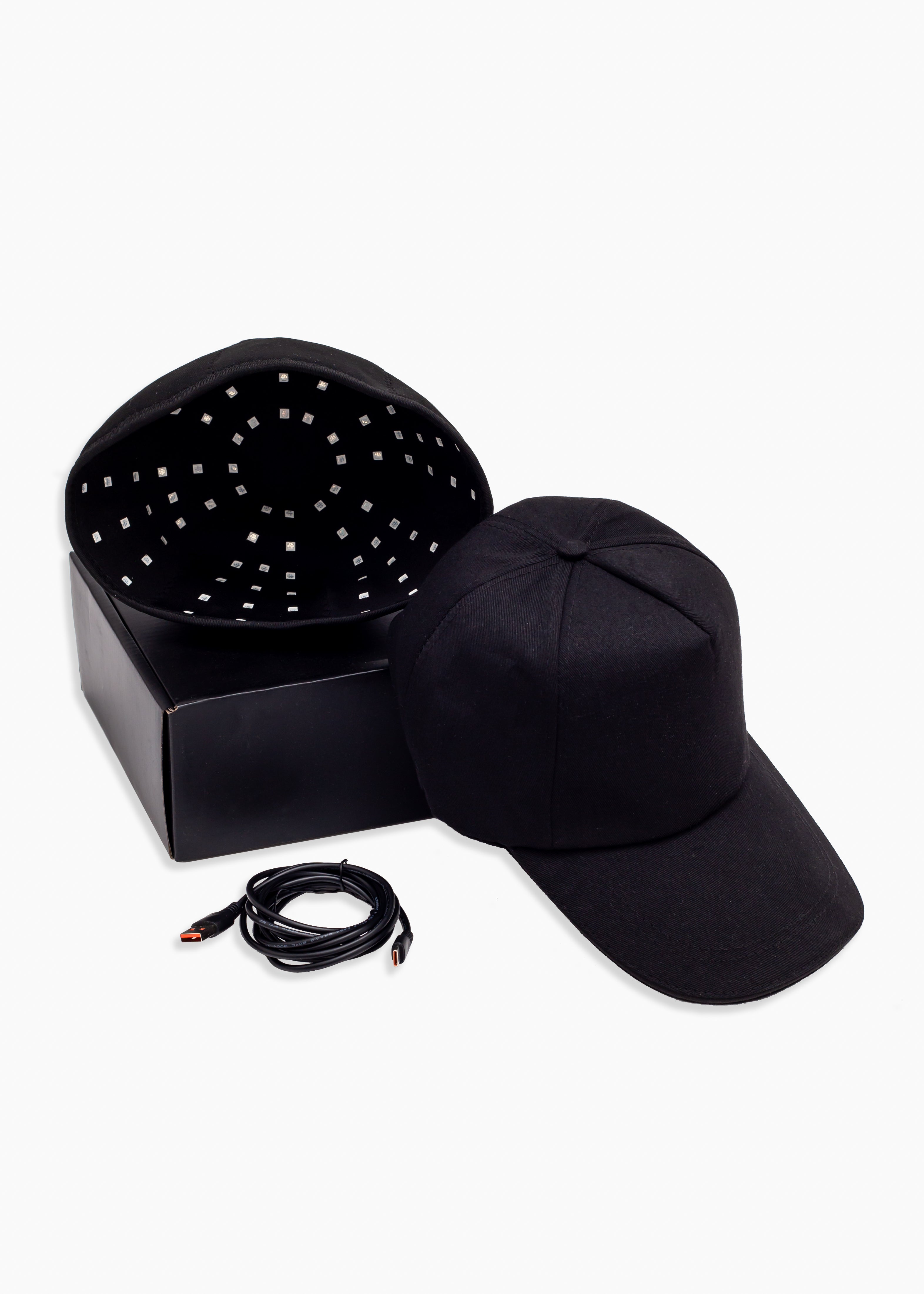 Black LED cap with control box and cable on a white background