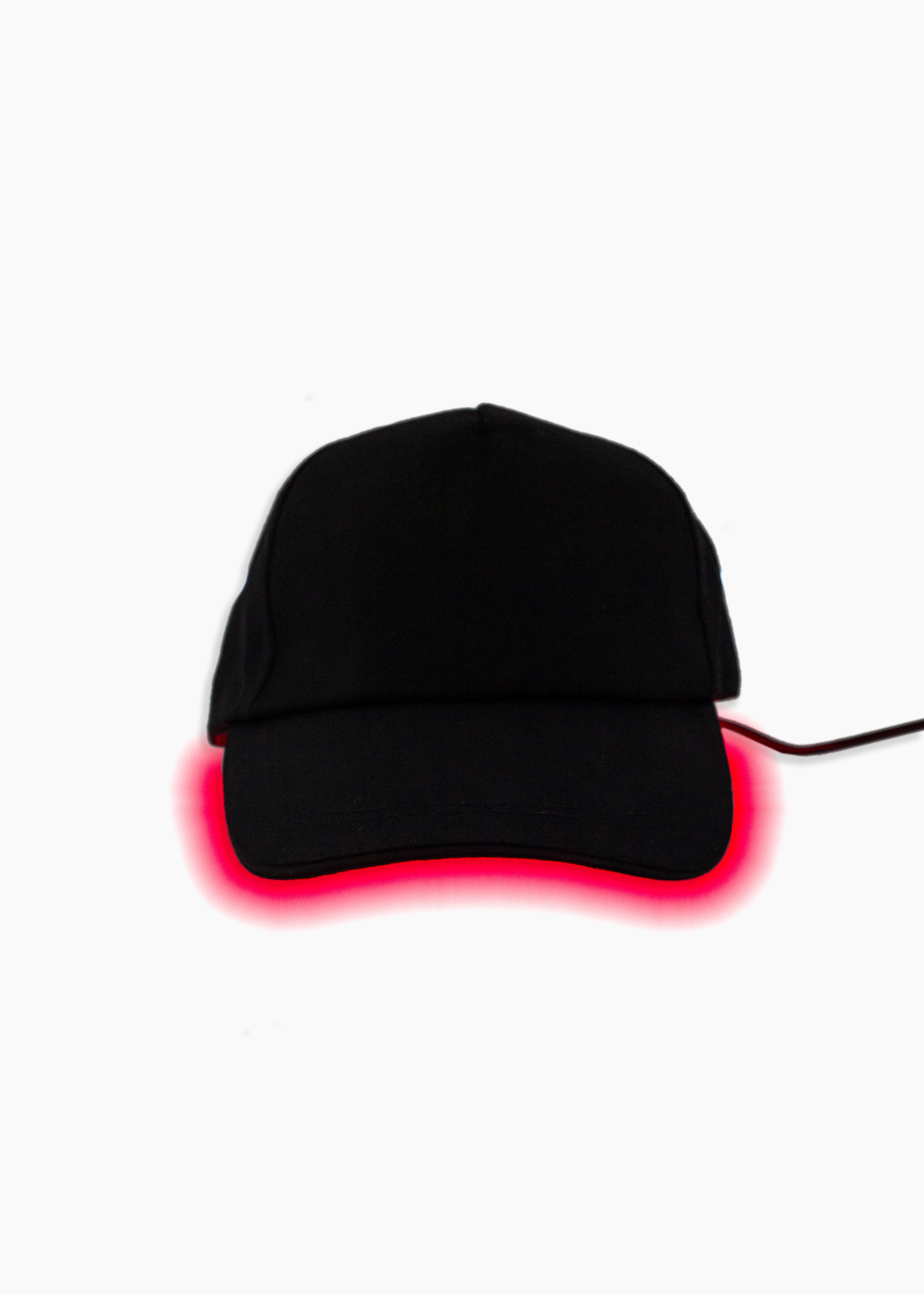 Black cap with red LED light on a white background